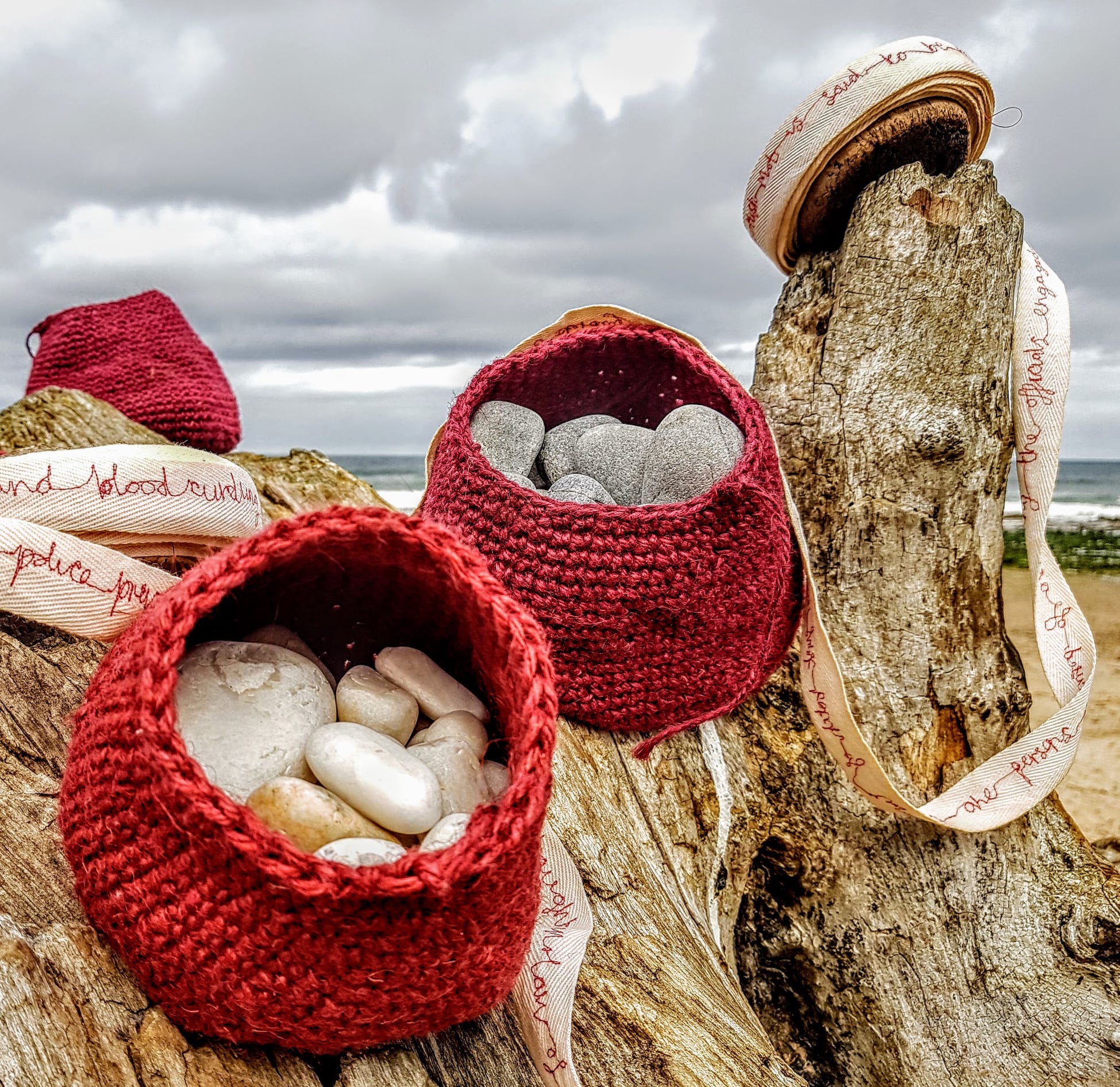 Lynda Buchan, held fast - buoys and ‘steens’, Jute yarn and Moray coast stones, 2020.