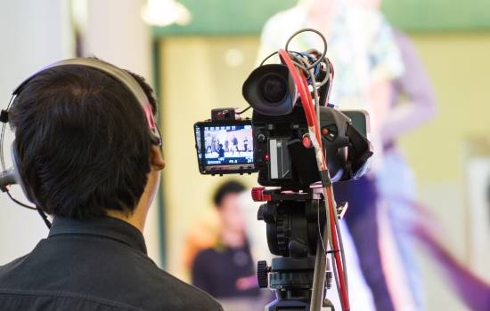 Student using camera equipment
