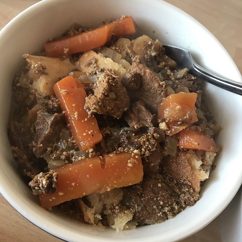 Traditional German dish of beef goulash with carrots and onion