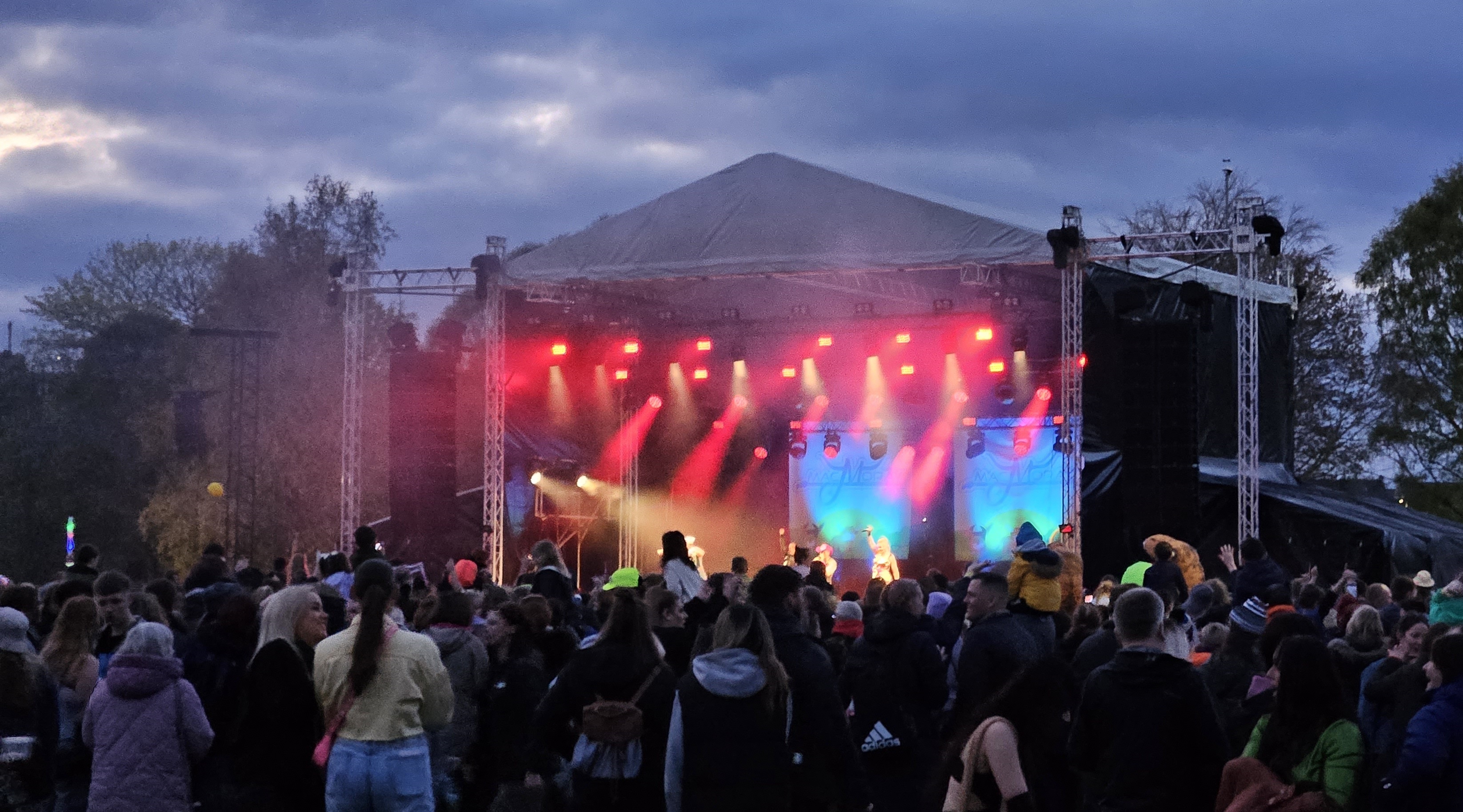 Photograph of the main stage at MacMoray 2023 with a lively crowd