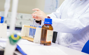 Scientist at work with test tubes