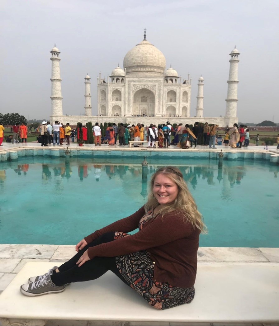Photograph of Kristy Jones, Co-Ordinator of the ESF Employability programme, sitting in front of the Taj Mahal in India