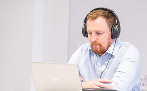 man doing online learing on laptop
