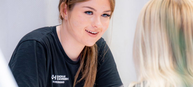 beauty student talking to a client