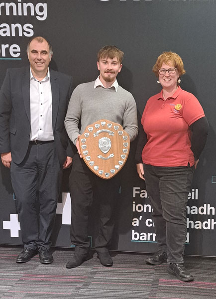 Joshua Whyte receiving his trophy