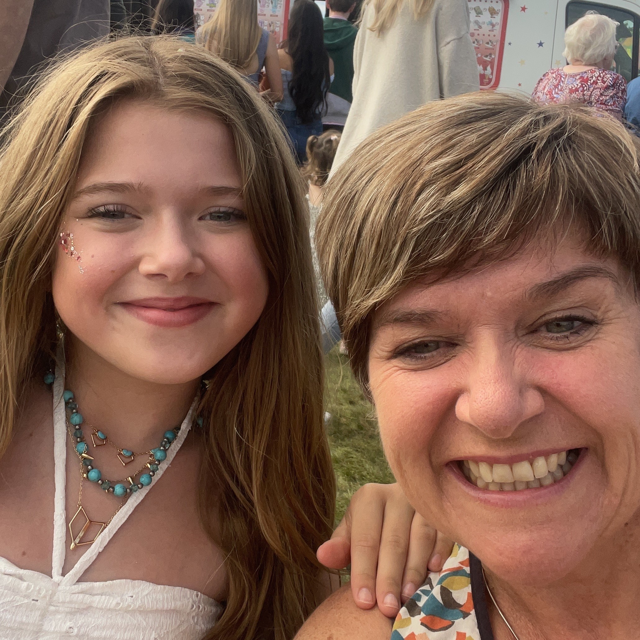 Photo of MA training co-ordinator Cindy with her daughter at a festival. Photo of MA training co-ordinator Cindy with her daughter at a festival.