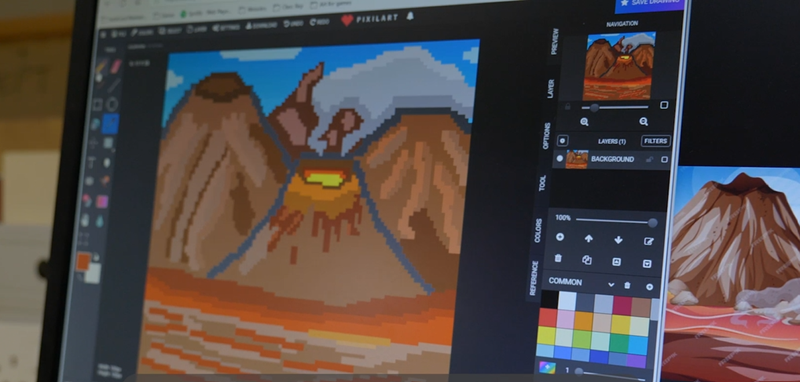 photo of an volcano erupting animation on a computer monitor photo of an volcano erupting animation on a computer monitor