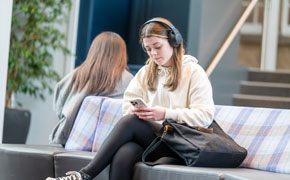 student looking at her phone