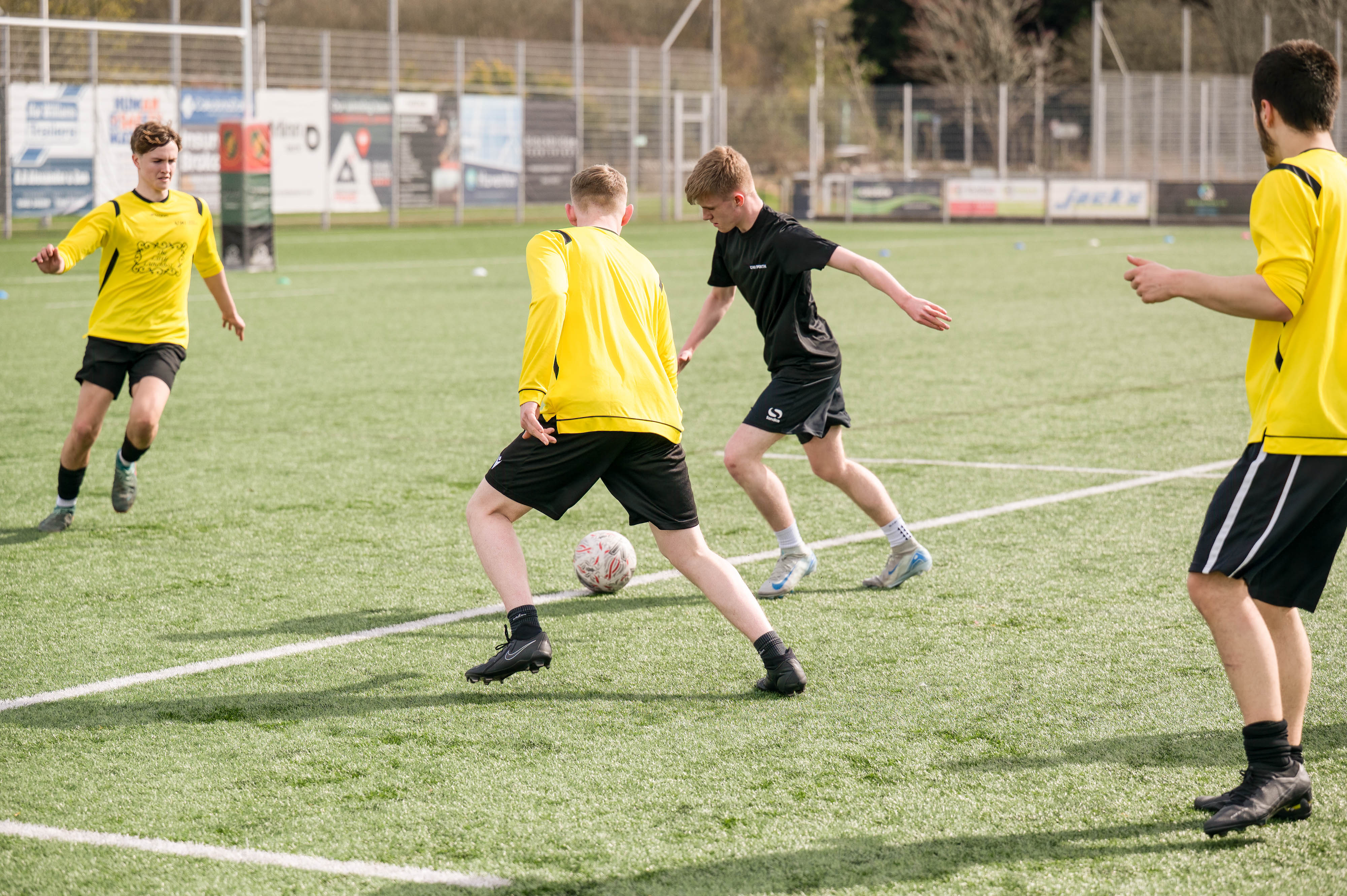 students playing in football match
