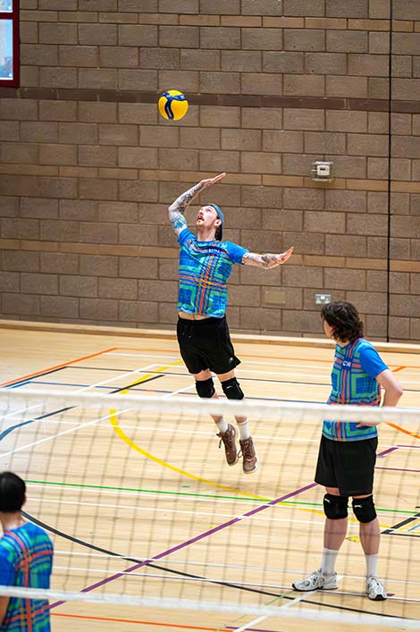 Lewis McMillan, president of the volleyball club at UHI Perth, mid-action during a game.